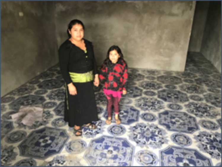 Consuelo Jorge Domingo and her daughter Evelyn in their new house under construction
