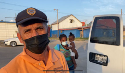 Lorenzo Ortiz a volunteer with the El Buen Samaritano Migrante church loading a van to drive Haitian immigrants in Del Rio, Texas