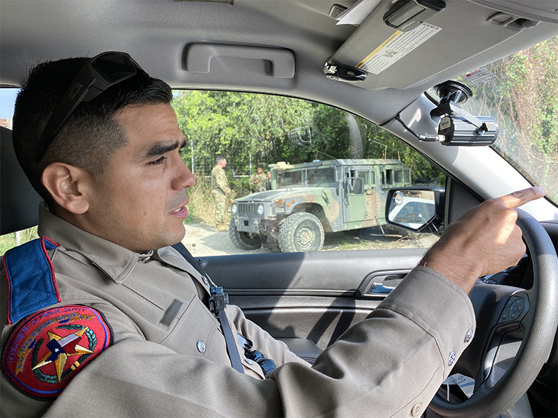 A Texas Department of Public Safety Highway Patrol Officer now working on the banks of the Rio Grande border with the also-deployed Texas National Guard