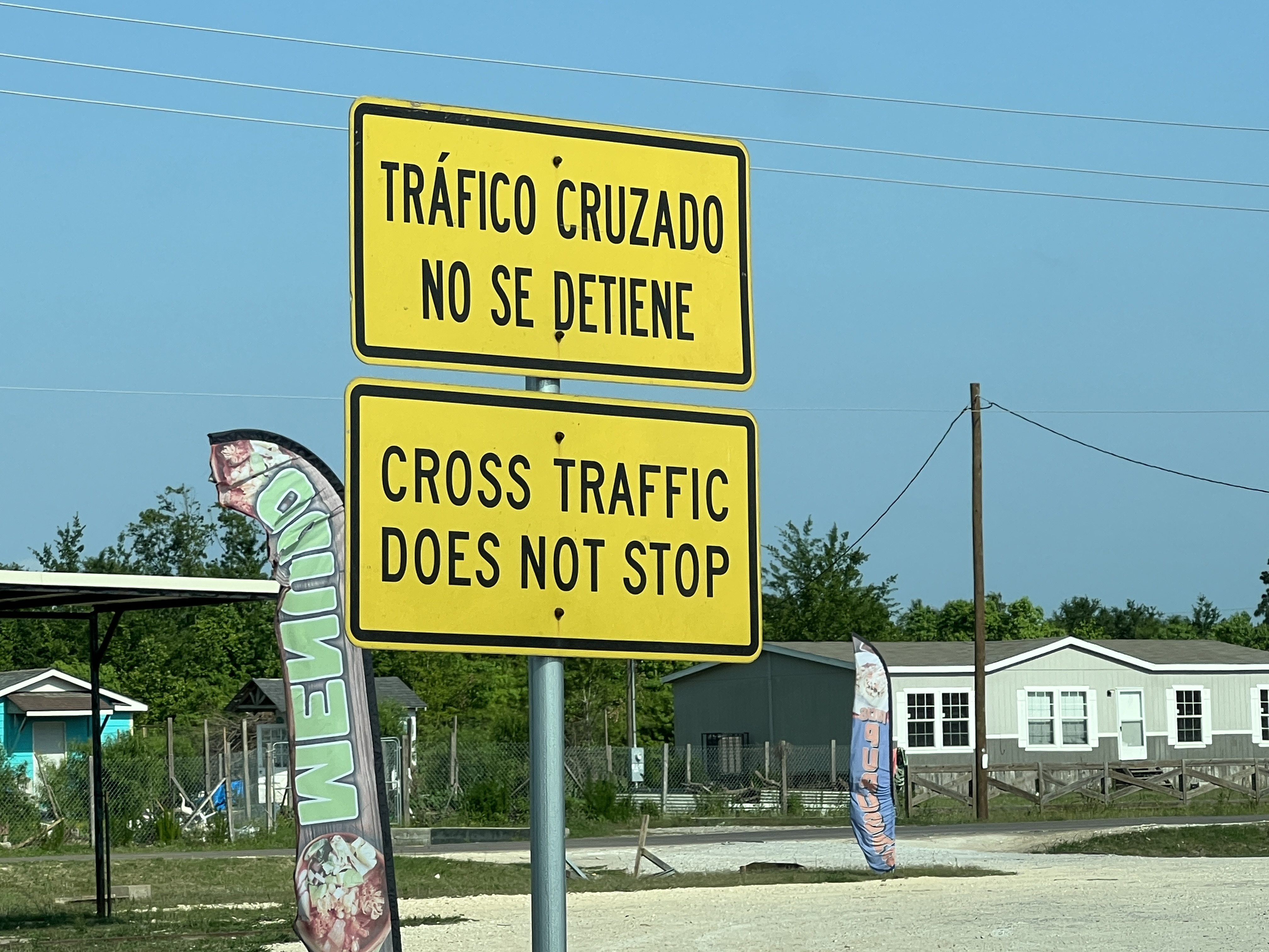 In tacit acknowledgement that large numbers of new Colony Ridge residents speak no or limited English, street signs like this one are often provided in Spanish