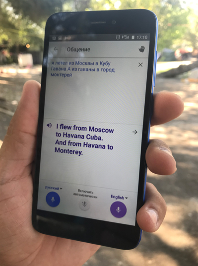 A Russian immigrant in Mexico speaks to the author using a translation app in 2018